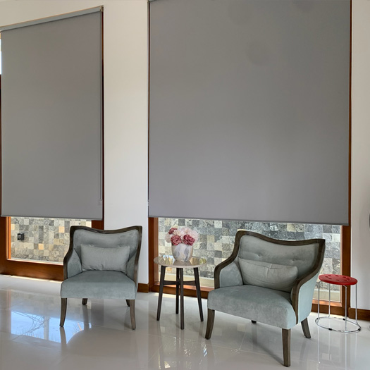 grey-roller-blinds-behind-grey-chairs